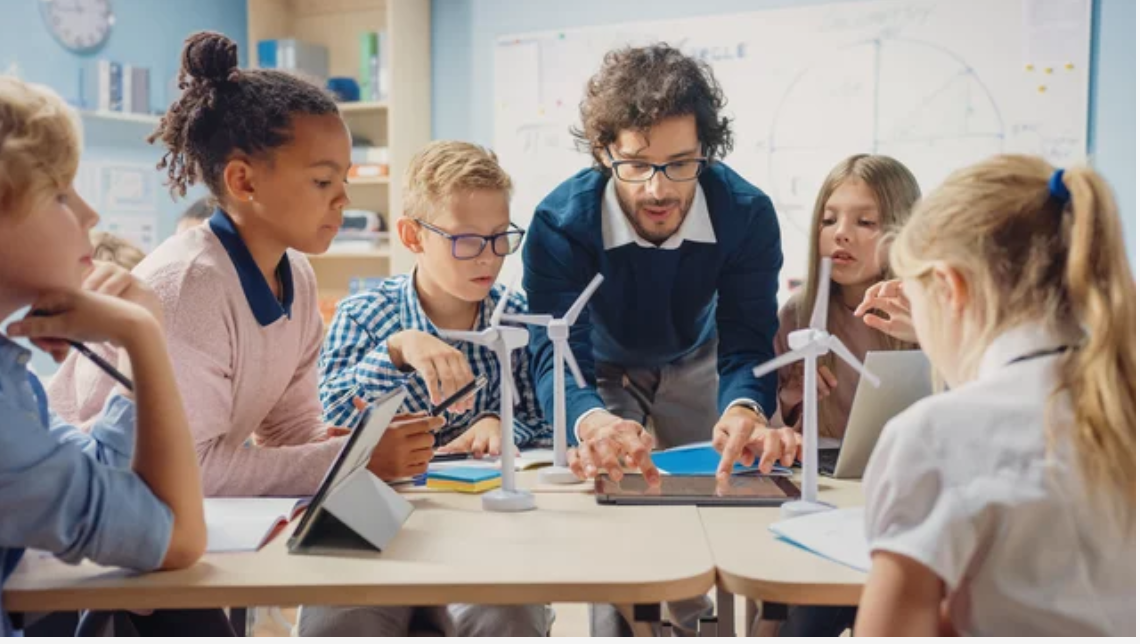 Teacher explaining use of school apps for students