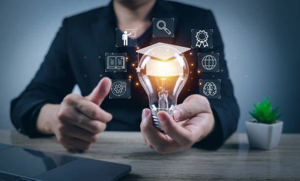 Businessman holding light bulb with trade school careers